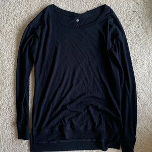 Lightweight black long sleeve with ribbed edge on sleeve and bottom relaxed fit